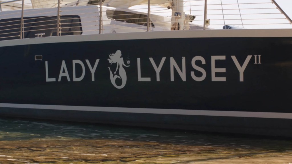 Side view of a boat with 'Lady Lynsey II' written on it and a mermaid logo.